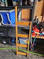 Full view of solid wood bunk bed ladder showing four rungs and light pine finish