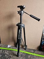 Full view of Velbon Victor 450 tripod with pan/tilt head and handle extended