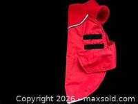 Red fleece-lined dog coat showing side profile and velcro tabs