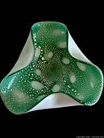 top view of green and white speckled tri-lobed art glass bowl