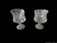 two clear footed crystal bowls