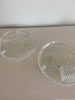 two clear glass round relish trays