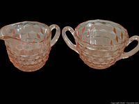 Pink Cube pattern creamer and sugar bowl side by side