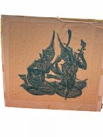 Overall view of the Thai temple rubbing showing two seated musician figures on tan rice paper