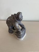 Front three-quarter view of soapstone Inuit hunter carving