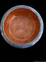 Interior view of bowl showing copper-peach lustre glaze