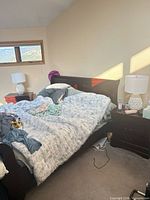 Overall view showing bed frame, both nightstands and both lamps in place