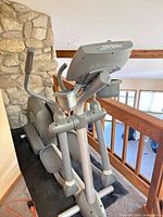 Full view of Life Fitness elliptical on mat