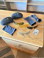 Entire lot displayed: two hard cases, two pouches, four lenses, nosepiece packet