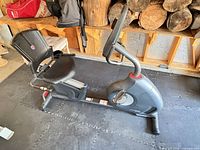Full side view of Schwinn recumbent bike on foam floor tiles