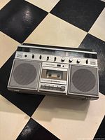 Front view showing full boombox with speakers and cassette deck