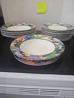 Stacked bowls and plates showing pattern and quantity