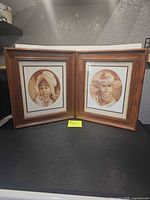 Both framed prints side by side