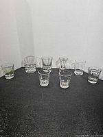 All eight assorted shot glasses displayed