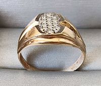Top view of 10K gold ring showing diamond cluster and band design