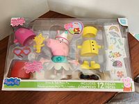 Retail boxed Peppa Pig Dress & Talk play set showing contents