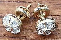 pair of yellow gold screw-back diamond cluster studs top and side view