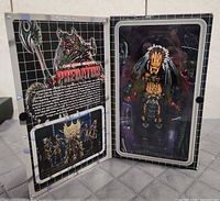 Open box showing Predator Clan Leader figure and flap artwork