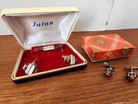 Overall view showing both cufflink sets with boxes