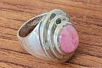 Top view of sterling silver ring with pink rhodochrosite stone