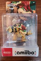 Front view of sealed Bowser amiibo in packaging