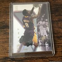 Front of Kobe Bryant Upper Deck card in plastic case