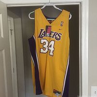 Full view of front of Lakers #34 jersey on hanger