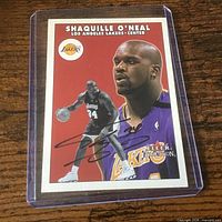 Front of signed Shaquille O’Neal Fleer Tradition card in plastic holder