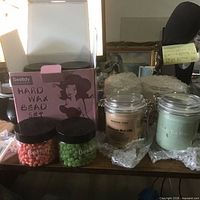 Overall lot showing hard wax bead kit, candles, mud masks