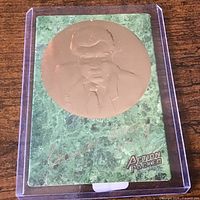 Card in protective sleeve showing entire front design