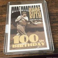 Card in protective sleeve showing front design and text