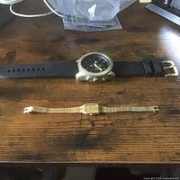 Both watches laid on table showing overall appearance