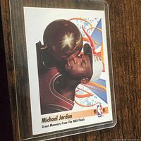 Front of sleeved Michael Jordan card, showing trophy image