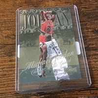 Front of card in plastic sleeve showing design and condition