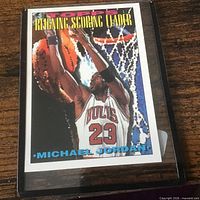 Front of Michael Jordan Reigning Scoring Leader card in plastic case
