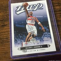 Front of card inside purple plastic top-loader