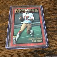 Front view of Joe Montana trading card in rigid holder