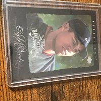 Front of 2003 Upper Deck Tiger Woods The Champions Lounge sample card in protective sleeve