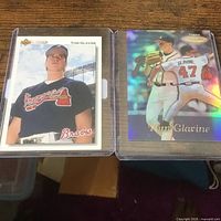 Fronts of both Tom Glavine cards in holders