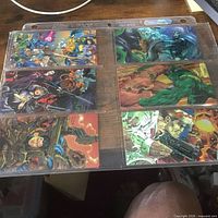 Two binder sleeves holding WildC.A.T.s cards
