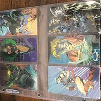 Sheet showing six WildC.A.T.S trading cards in sleeve