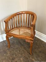 Front view of solid wood chair with cane seat