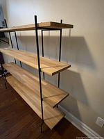 Angled side view highlighting shelf thickness and frame construction