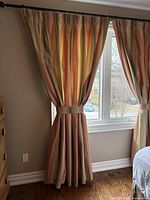 Curtain panel hanging, shows fabric, pleats, full length