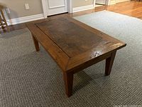 Full view of teak coffee table top and legs