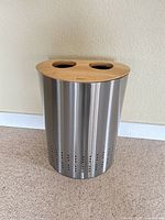Front view of stainless steel hamper showing perforated vents