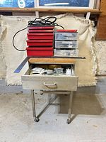 Full view of cart with toolbox, organizer, extension cord, cart drawer closed