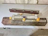 Top view of Craftsman dovetail jig with wood base and Sands spirit level