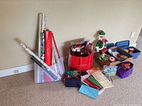 overall lot view showing wrapping paper rolls, bags, bins, elf