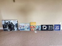 All six art pieces lined up for size and type reference